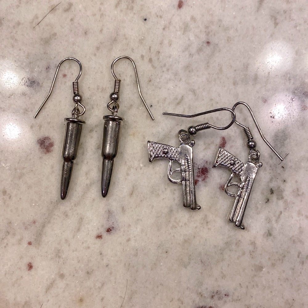 Silver bullet and gun earring sold as set